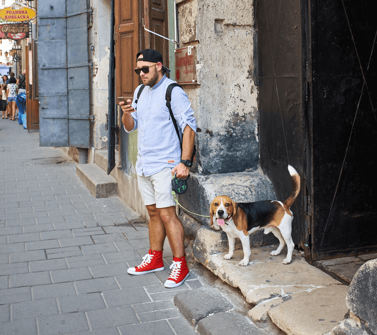 dog owner with retractable dog leash